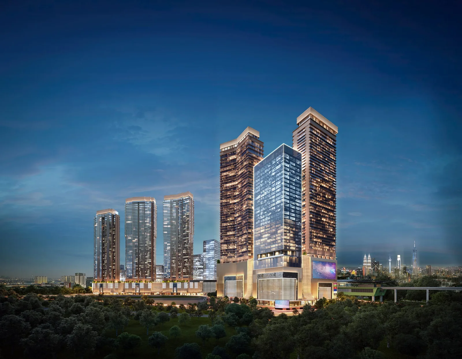 Lit Pavilion Damansara Heights towers against a dusk sky over Kuala Lumpur
